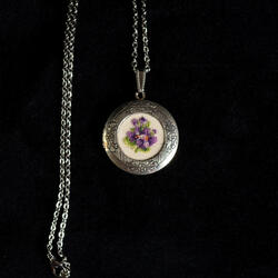 Open pendant decorated with violet gobelin on necklace